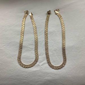 Pair of gold color metal necklaces